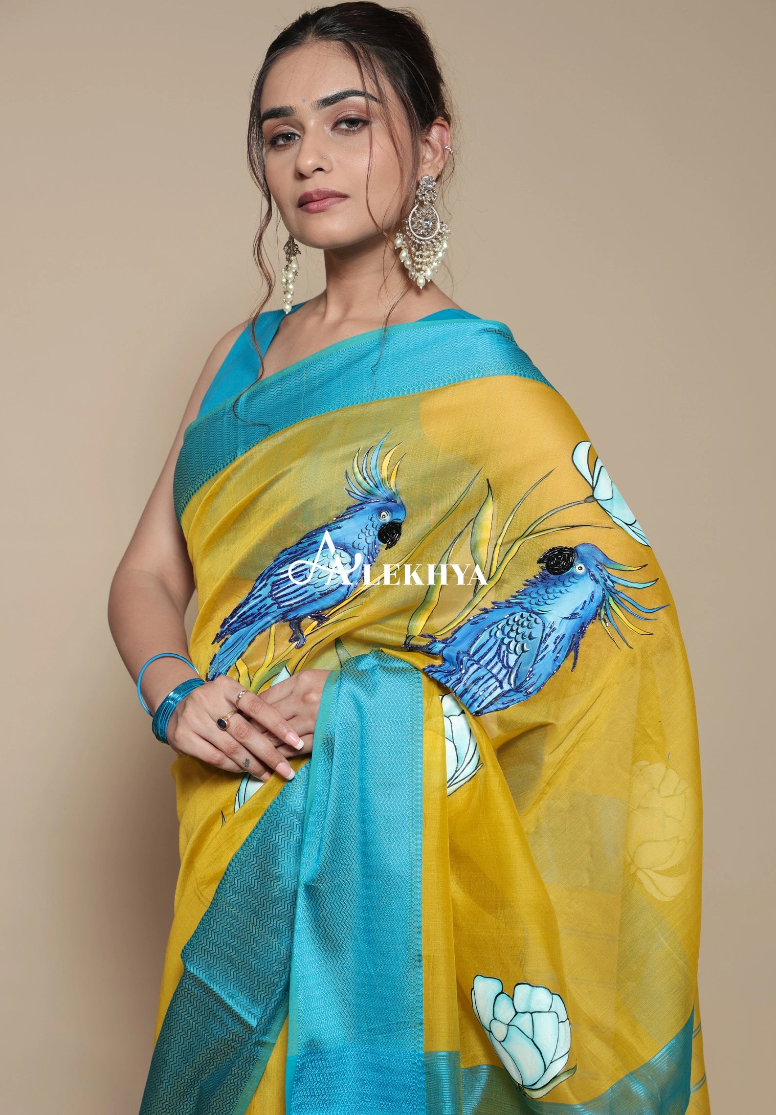 Macaw Majesty- Maheshwari Handloom Saree